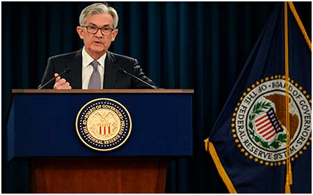 Fed trzykrotnie podniesie główną stopę procentową w 2022 r.